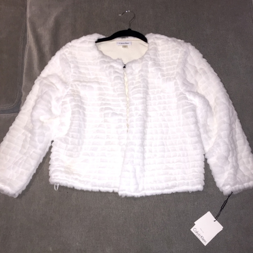 Faux fur 3/4 length sleeve jacket. Perfect condition never worn
